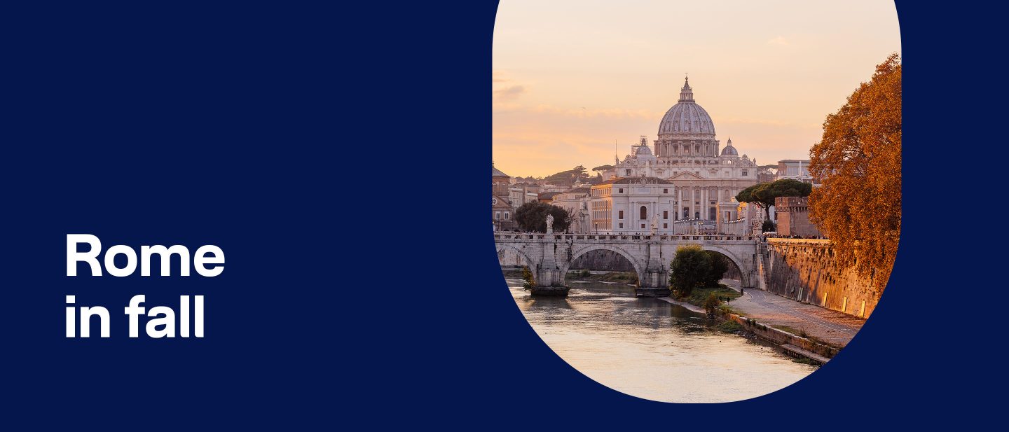 View of St. Peter's Basilica and the Tiber River in Rome during fall at sunset with autumn trees and historic bridge.