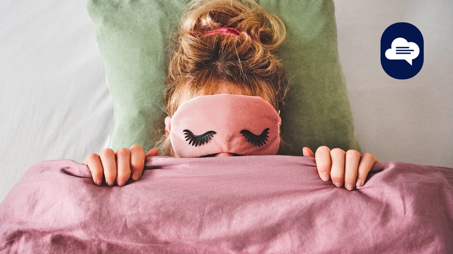 Woman sleeping with a pink eye mask.